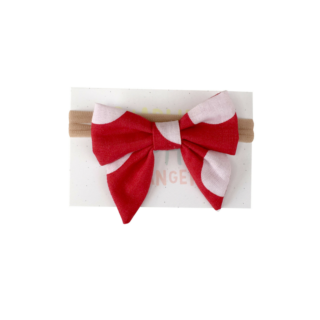 Red bow with big white dots