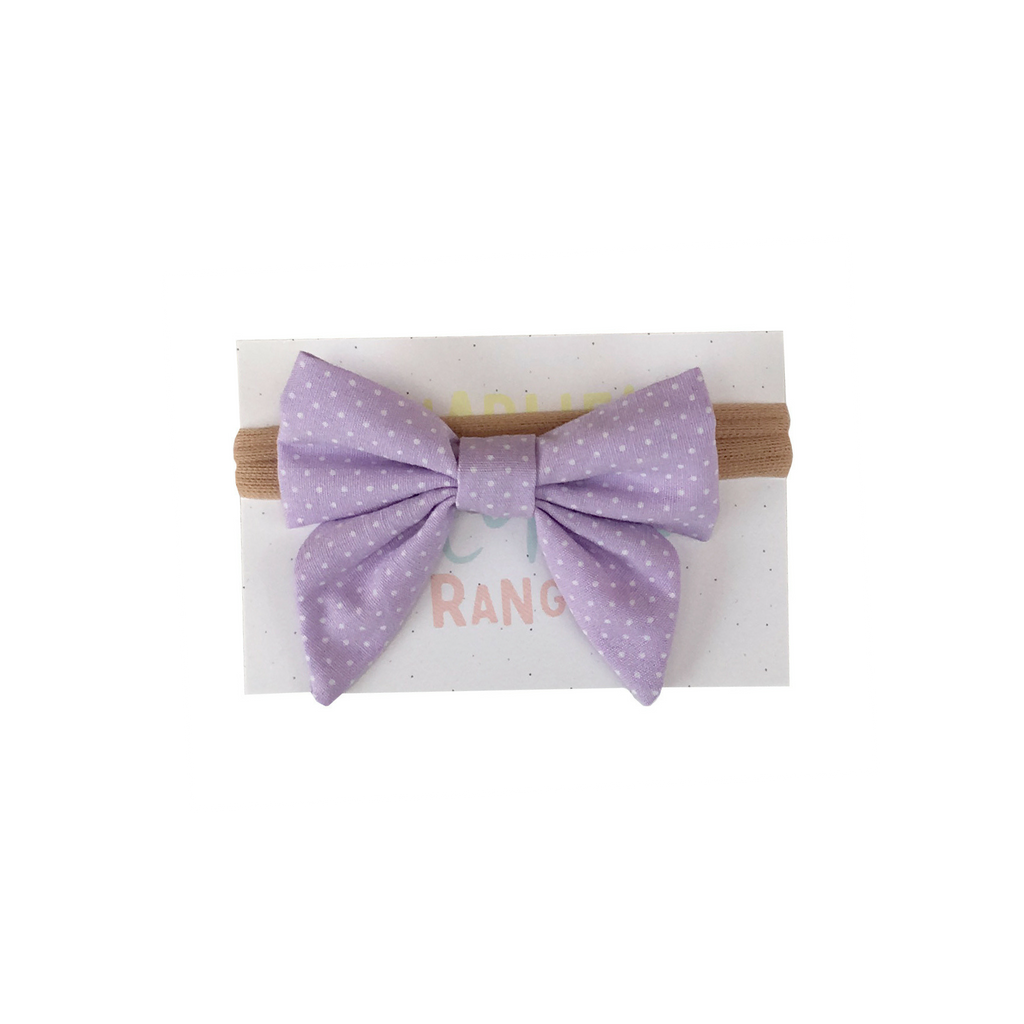 Lavender hairbow with tiny white dots