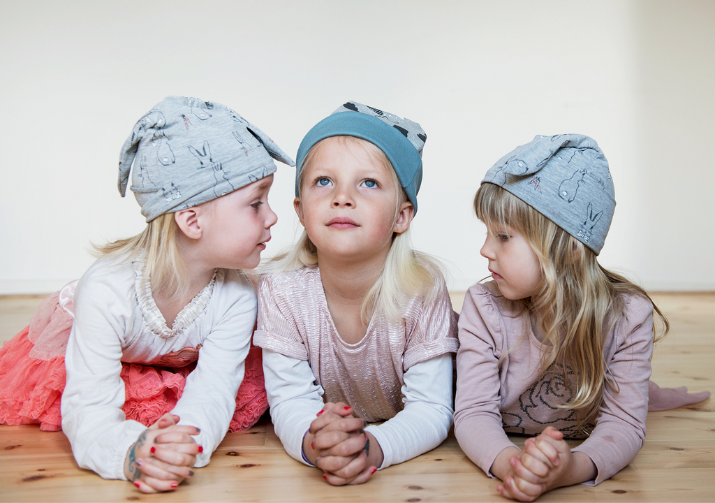 3 young girls wearing beanies