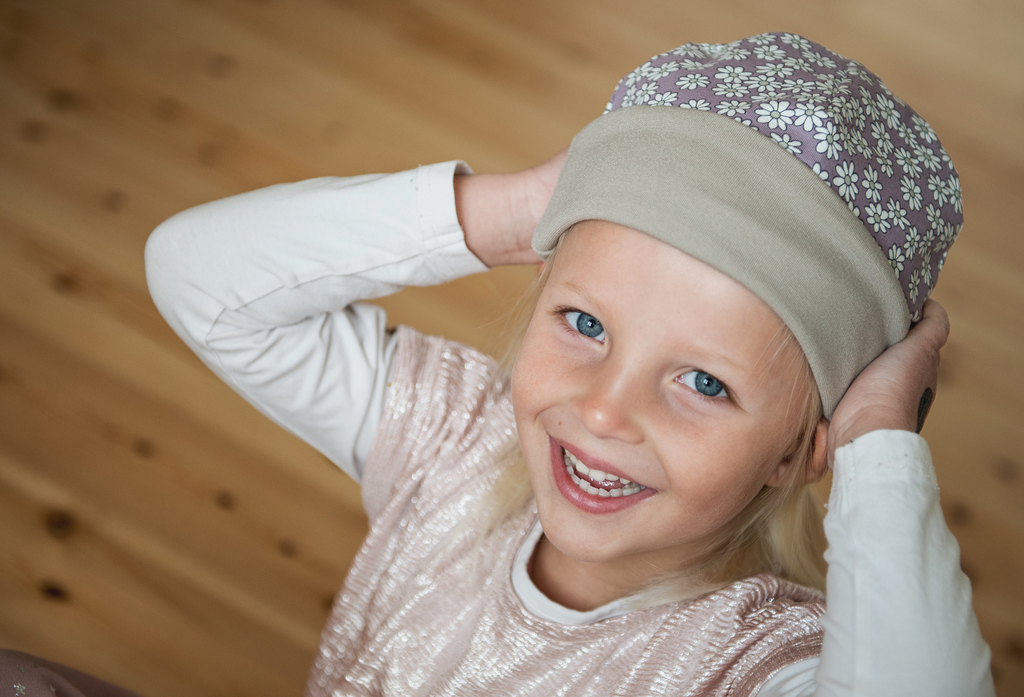 Girl with purple beanie with folded rim